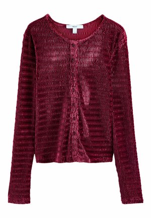 Burgunderfarbener Samt-Cardigan mit langen Ärmeln, strukturiertem Stoff, Knopfverschluss vorne und gerippten Details. Runde Halslinie und enganliegende Ärmel.