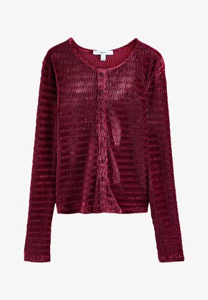 Burgunderfarbener Samt-Cardigan mit langen Ärmeln, strukturiertem Stoff, Knopfverschluss vorne und gerippten Details. Runde Halslinie und enganliegende Ärmel.