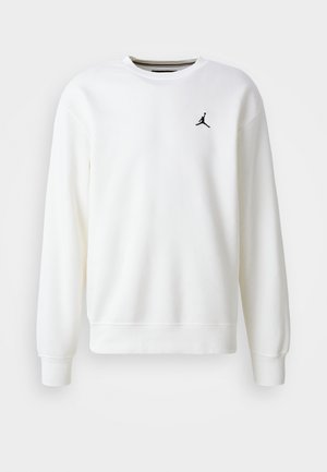 Hvit crewneck sweatshirt laget av myk stoff, med en svart Jumpman-logo på venstre bryst og ribbede mansjetter og kant.