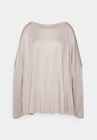 Světle béžový dlouhý rukáv, volný střih s širokým výstřihem a spadlými rameny, vyrobený z měkké, lehké tkaniny s mírně texturovaným povrchem.
