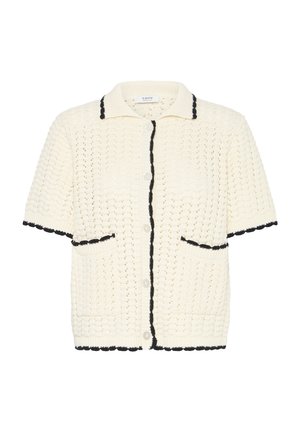 Krēmkrāsas īsroku adīts kardigans ar melnu apmali apkaklītei, pogu līnijai, kabatām, piedurknēm un apakšmalai, ar teksturētu, atvērtā pinuma rakstu.