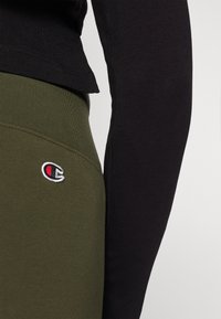 Champion ICONS HIGH WAIST FLARE LEGGINGS - Tamprės - dark green