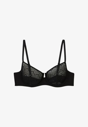 Soutien-gorge noir avec armatures, doté de bonnets en dentelle transparente présentant un motif en chevron et de fines bretelles réglables.