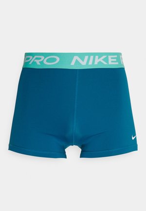 Nike Pro kompressionsshorts i blågrøn med en lyseblå elastisk linning med hvid "NIKE PRO" tekst og en lille logo nederst til højre.