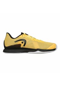 Zapatillas deportivas amarillas con parte superior de malla, detalles en negro, suela acolchada y suela de goma texturizada para un mejor agarre; diseño moderno y estiloso.