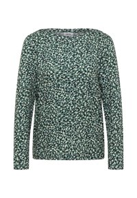 Haut vert à manches longues avec un motif de taches noires et blanches, fabriqué en tissu doux avec un col rond et une coupe décontractée.