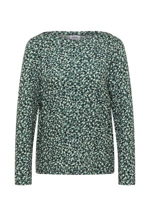 Green long-sleeve top featuring a pattern of black and white spots, made from soft fabric with a round neckline and relaxed fit.