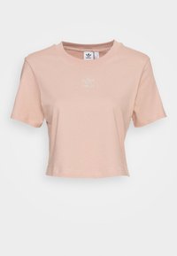 Ljusrosa, kortärmad t-shirt i bomull med rund halsringning. Liten, reflekterande logotypdetalj på bröstet.