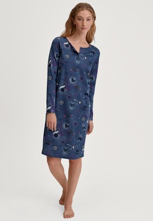 Chemise da notte a maniche lunghe in blu navy con un motivo a tema spaziale. Presenta un collo henley e un design lungo fino al ginocchio. Tessuto morbido.