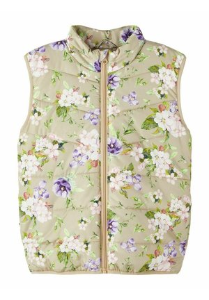 Veste matelassée beige sans manches avec fermeture éclair, présentant un motif floral de fleurs blanches et violettes avec des feuilles vertes.