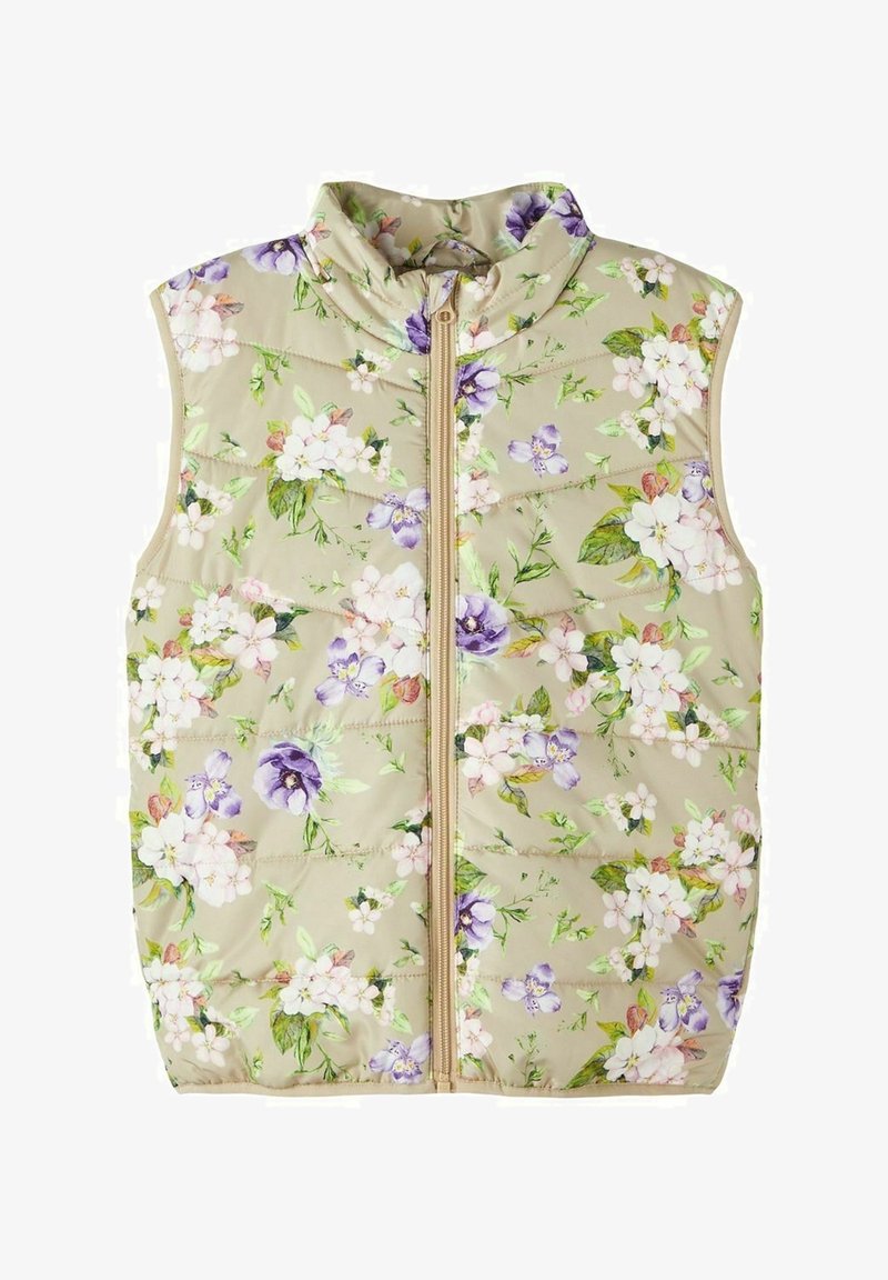 Veste matelassée beige sans manches avec fermeture éclair, présentant un motif floral de fleurs blanches et violettes avec des feuilles vertes.