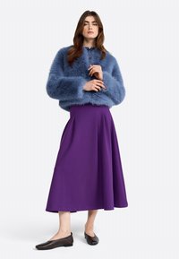 Fuzzy blue cropped sweater, purple A-line skirt, and brown flats. The sweater features a soft texture and loose fit. Skirt has a smooth finish.
