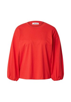 Rotes Baumwolloberteil mit langen Ärmeln, runder Ausschnitt und voluminösen Ärmeln. Es hat eine lockere Passform und ein minimalistisches Design.
