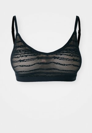 Zwarte kanten bralette met een textuur in een golfachtig patroon, dunne verstelbare bandjes en een naadloze onderband voor ondersteuning.