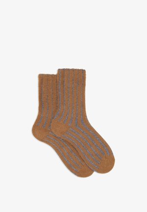 Calzini marroni a coste con texture morbida, caratterizzati da dettagli a strisce blu e un design classico a lunghezza media.