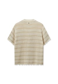 Beige short-sleeve top with a woven texture, featuring a scalloped hem and back neckline detail. Lightweight and open-knit design.