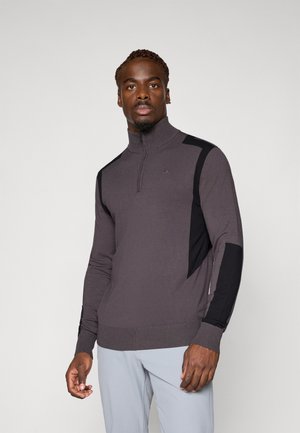 Pullover grigio scuro con colletto a zip, caratterizzato da dettagli neri e un design aderente. Realizzato in tessuto testurizzato con orlo e polsini a coste.