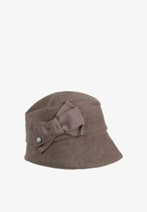 Brown felt bucket hat with wide brim featuring a large matching fabric bow and a small round metal brand tag on the side.