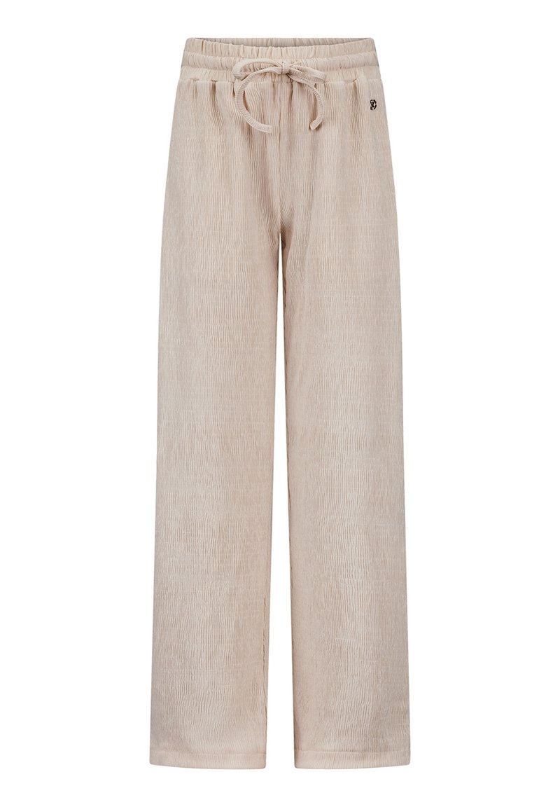 Béžové široké kalhoty vyrobené z texturované tkaniny. Mají elastický pas se stahovací šňůrkou a decentní branding na straně.