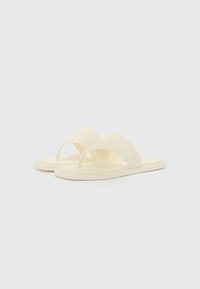 Yellow rubber slide sandals with a wide strap and thong design. The sole is flat and textured for grip. Minimal branding on the strap.