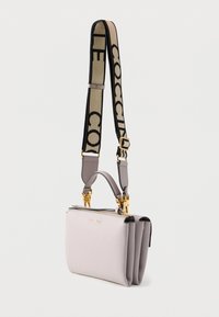 Light gray leather handbag with a structured design, top handle, and gold hardware. Features a black and beige adjustable shoulder strap.
