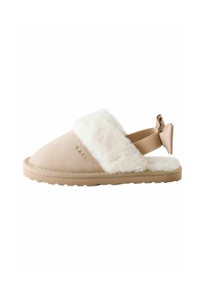 Chaussons beige confortables avec un col en fourrure blanche, en doux matériau en suédé, conception à enfiler et semelle en caoutchouc. Comprend un nœud décoratif au niveau du talon.