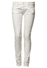 Jean skinny blanc en tissu mélangé coton, avec une taille mi-haute, cinq poches et un classique bouton-pression. Texture lisse, design minimal.