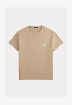 Tricou bej cu mâneci scurte și decolteu rotund, cu mic logo alb Polo Ralph Lauren pe pieptul stâng.