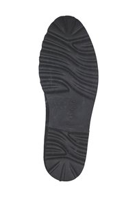 Schwarze Gummisohle mit strukturierten Mustern für besseren Halt, featuring eine leicht erhöhte Mitte und dem eingprägten Markennamen "Gabor" an der Seite.