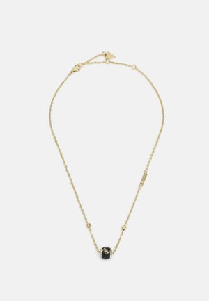 Gold chain necklace with a small black bead pendant featuring gold decorative initials and a lobster clasp closure.