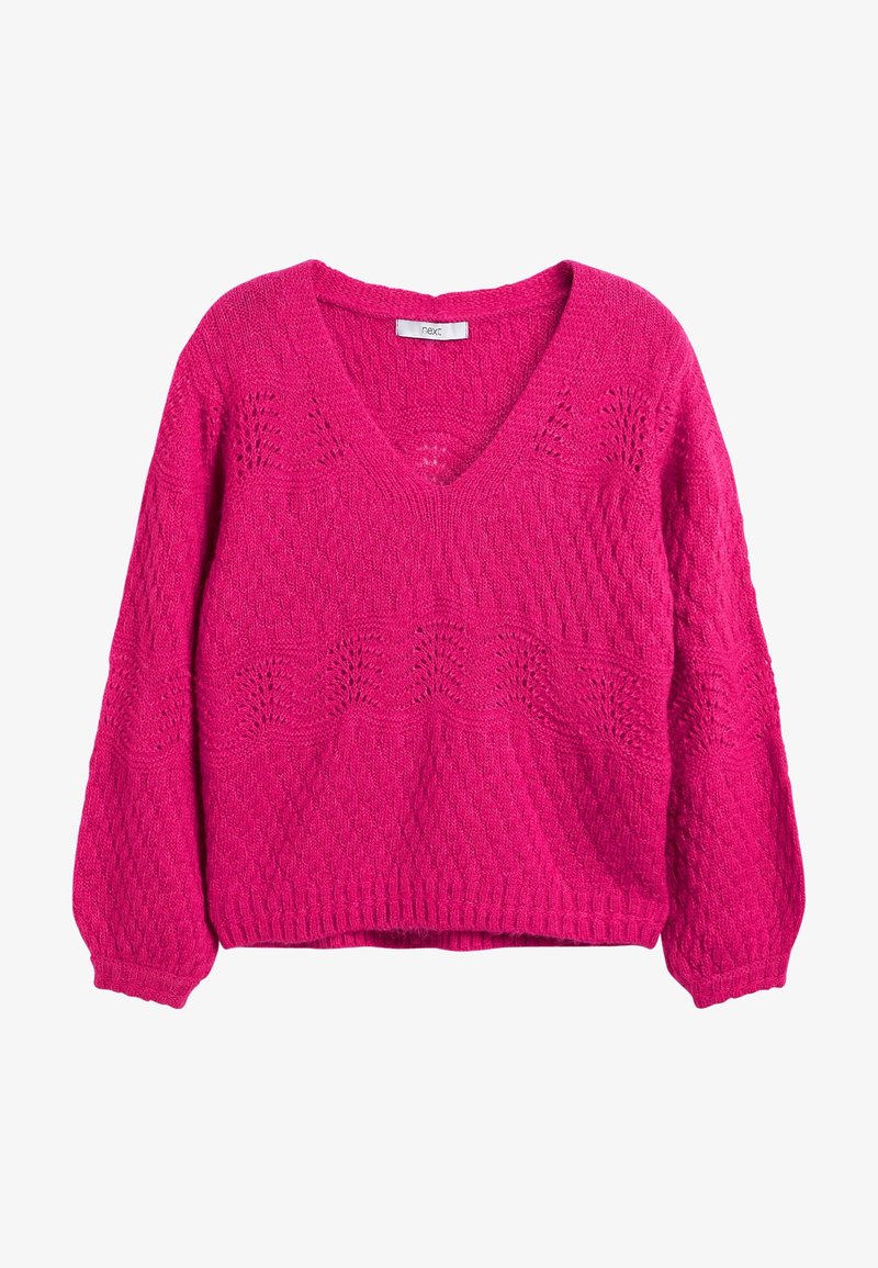 Pull tricoté rose vif avec col en V, manches longues et détails en dentelle à motifs sur la poitrine et les poignets.