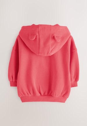 Koraalroze sweatshirt met capuchon, afgeronde zoom, elastische manchetten en oren op de capuchon. Zacht materiaal, losse pasvorm.