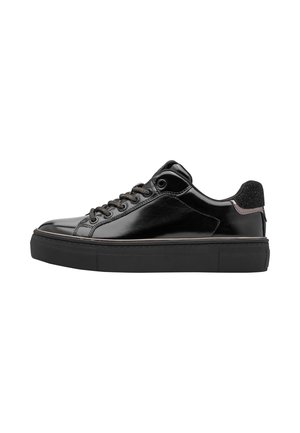 Glossy black low-top sneaker with lace-up front, black thick sole, and textured black heel tab against white background.