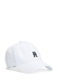 White baseball cap made of cotton, featuring a curved visor and an embroidered logo in dark blue on the front.