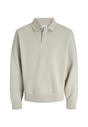 Sweatshirt polo beige clair avec une texture douce, un col classique, une patte de boutonnage à trois boutons et des bords côtelés aux poignets et à l'ourlet.