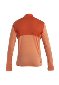 Camicia a maniche lunghe in una sfumatura di arancione. Presenta un colletto alto, tessuto testurizzato e cuciture a contrasto lungo le cuciture.