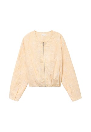 Vaalean persikanvärinen vetoketjullinen takki, jossa on pitkät hihat ja hienovarainen kukkakirjailu. Takissa on pyöreä pääntie ja joustava helma.