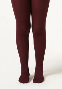 Burgundy ogen tights med en slät yta, som täcker benen ner till anklarna, med en sömlös design och mjuk finish.