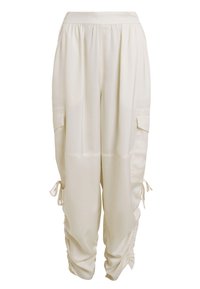 Lichtbeige cargobroek van gladde stof met een elastische tailleband, zijzakken en trekkoord aan de manchetten.