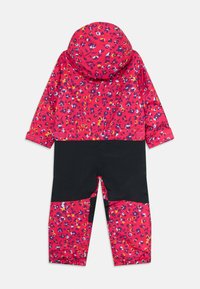 Tuta da pioggia intera per bambini con un motivo floreale rosso, viola e giallo su cappuccio, maniche e parte bassa delle gambe, e nero uniforme su torso e parte alta delle gambe.