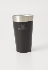 Black stainless steel tumbler with a shiny silver rim and engraved logo. Smooth matte finish with a tapered shape for easy grip.