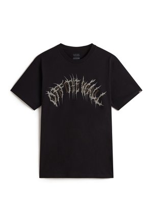 T-shirt in cotone nero con stampa grafica testurizzata argento della scritta "Off The Wall" con accenti frastagliati sul petto. Maniche corte, collo a giro.