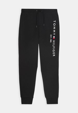 Zwarte sweatpants gemaakt van zachte stof, met een trekkoord in de taille en een geprinte "TOMMY HILFIGER"-logo met oprichtingsdatum op de zijkant.