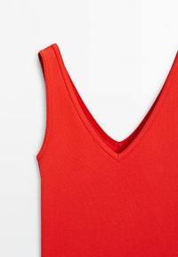 Red sleeveless tank top with a V-neckline shown on a white background.