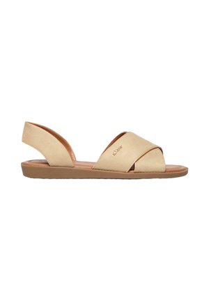 Sandale plate beige avec des brides croisées à l'avant, bout ouvert, bride arrière au talon et semelle basse rembourrée.