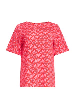 Short-sleeve blouse in bright red with a repeating white shell pattern. Features a crew neckline and back keyhole closure.