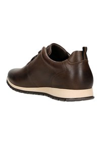 Brown leather shoe with textured side panels, rounded toe, and contrasting cream rubber sole. Black laces and heel tab included.