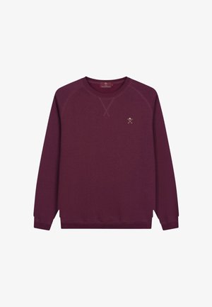 Sweatshirt à col ras du cou bordeaux en tissu doux, avec un col et des poignets côtelés, présentant un petit motif brodé sur la poitrine.