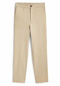 Beiget housut, jotka on valmistettu sileästä kankaasta. Niissä on suora etuosa, sivutaskut, vetoketjullinen haarakiinnitys ja yksittäinen nappikiinnitys.