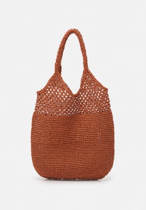 Brown woven crochet tote bag with open upper mesh pattern and two rounded shoulder straps.